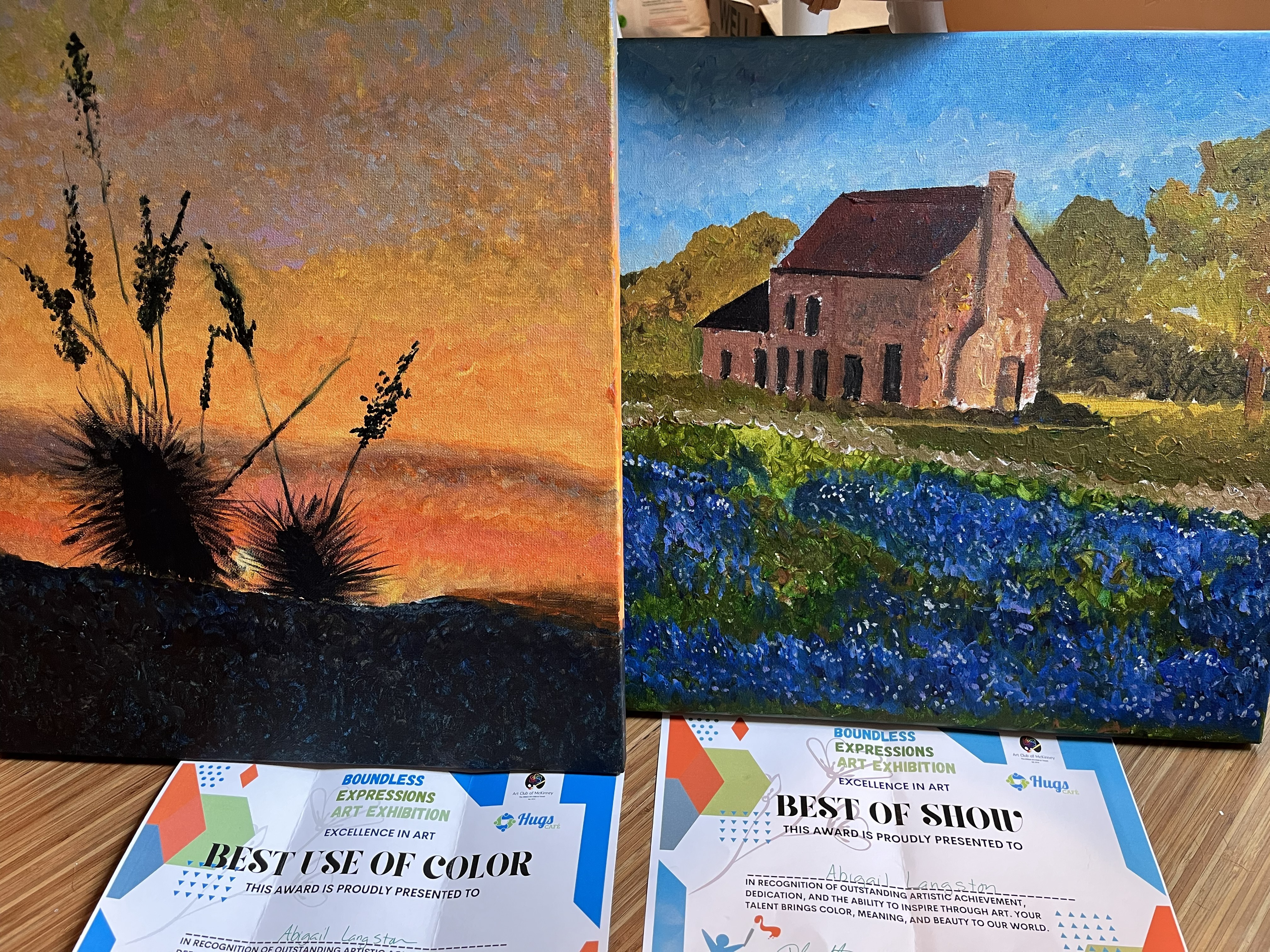 Two paintings with the awards they won